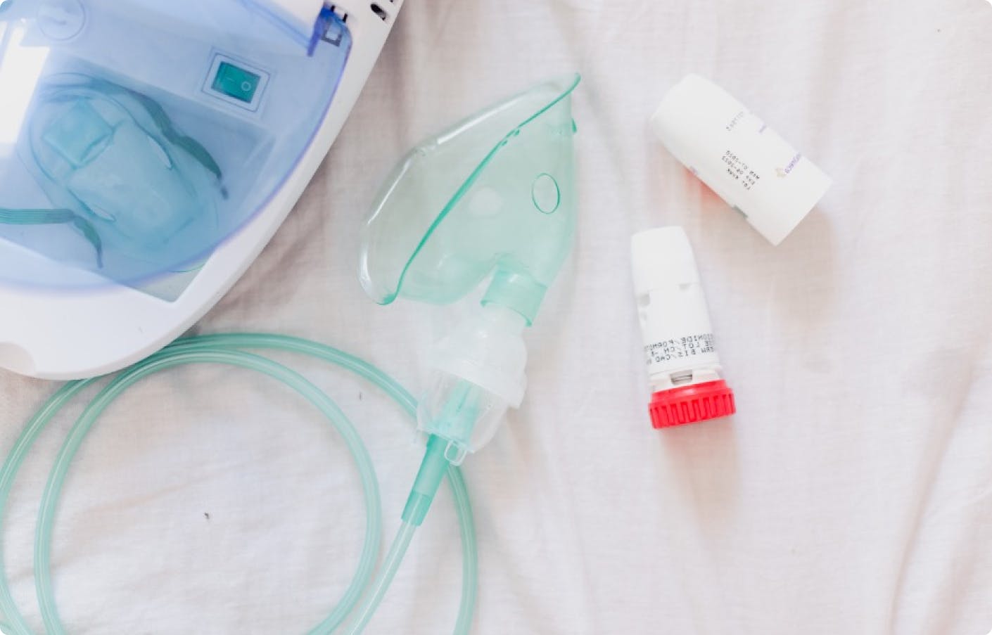 an iv and a tube laying on a bed
