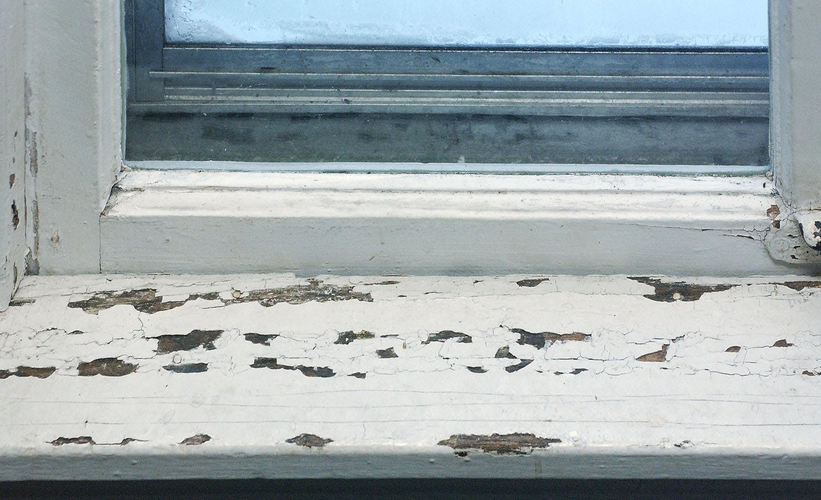 Lead paint on an old window frame.